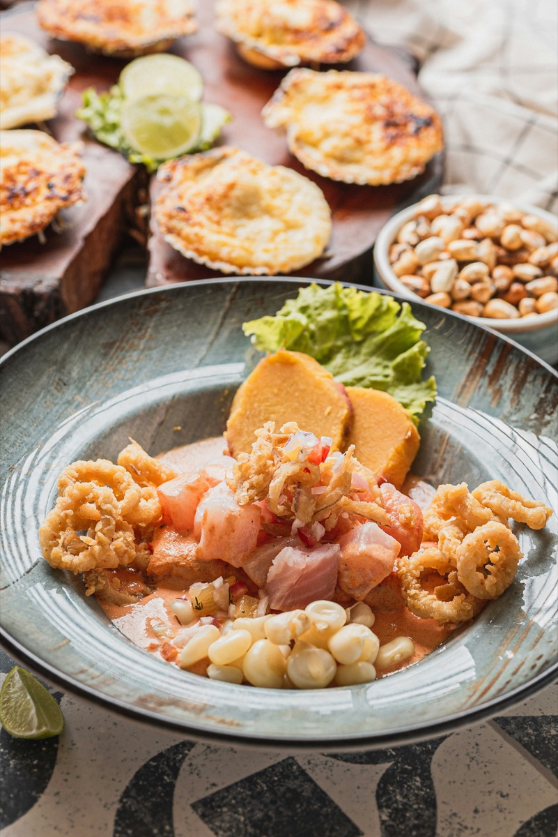 Peruvian ceviche with sweet potato, corn, and fried calamari — a classic dish taught in Cusco cooking classes