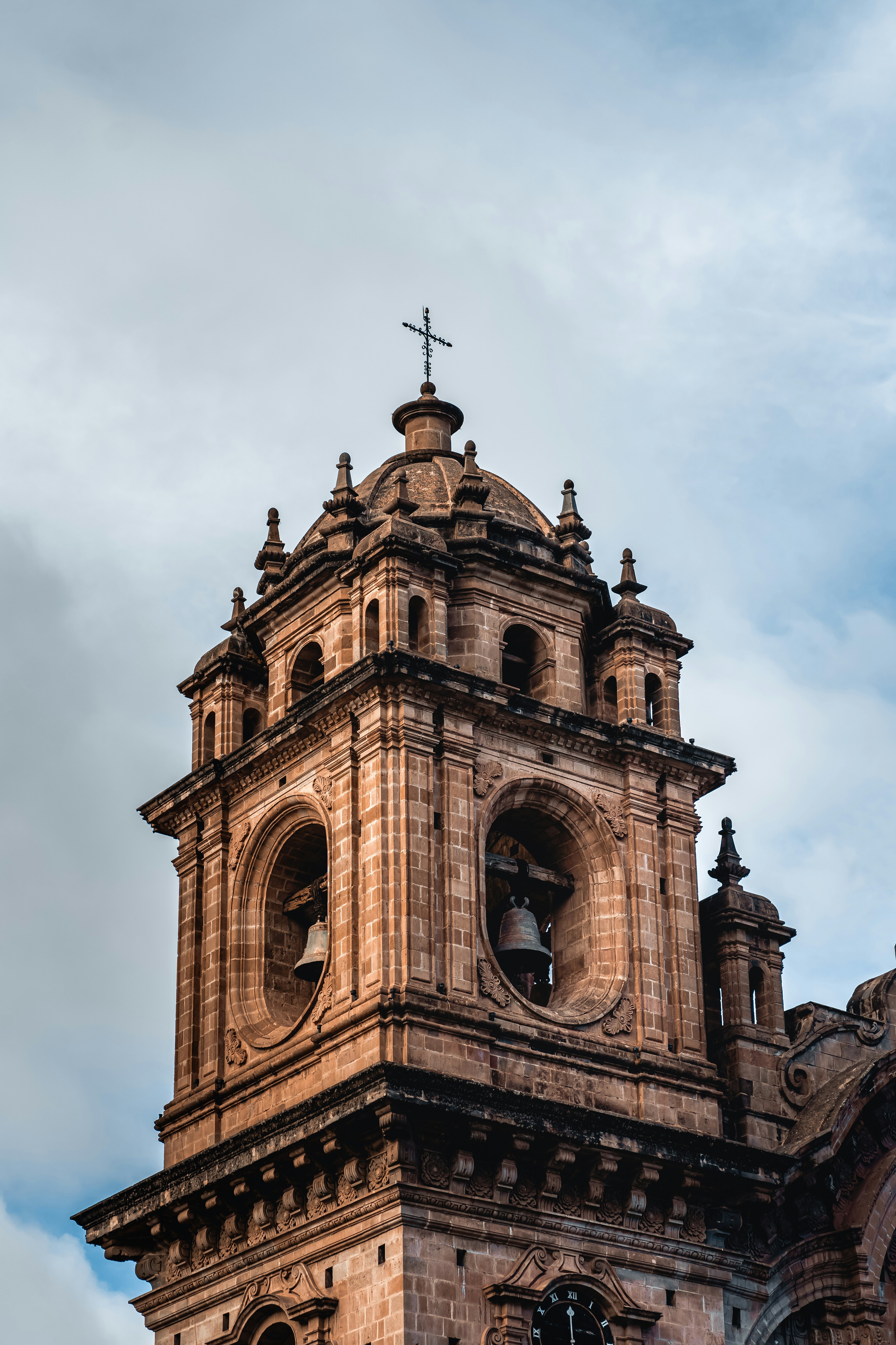Colonial stone church bell tower in warm afternoon light, Ayacucho Peru