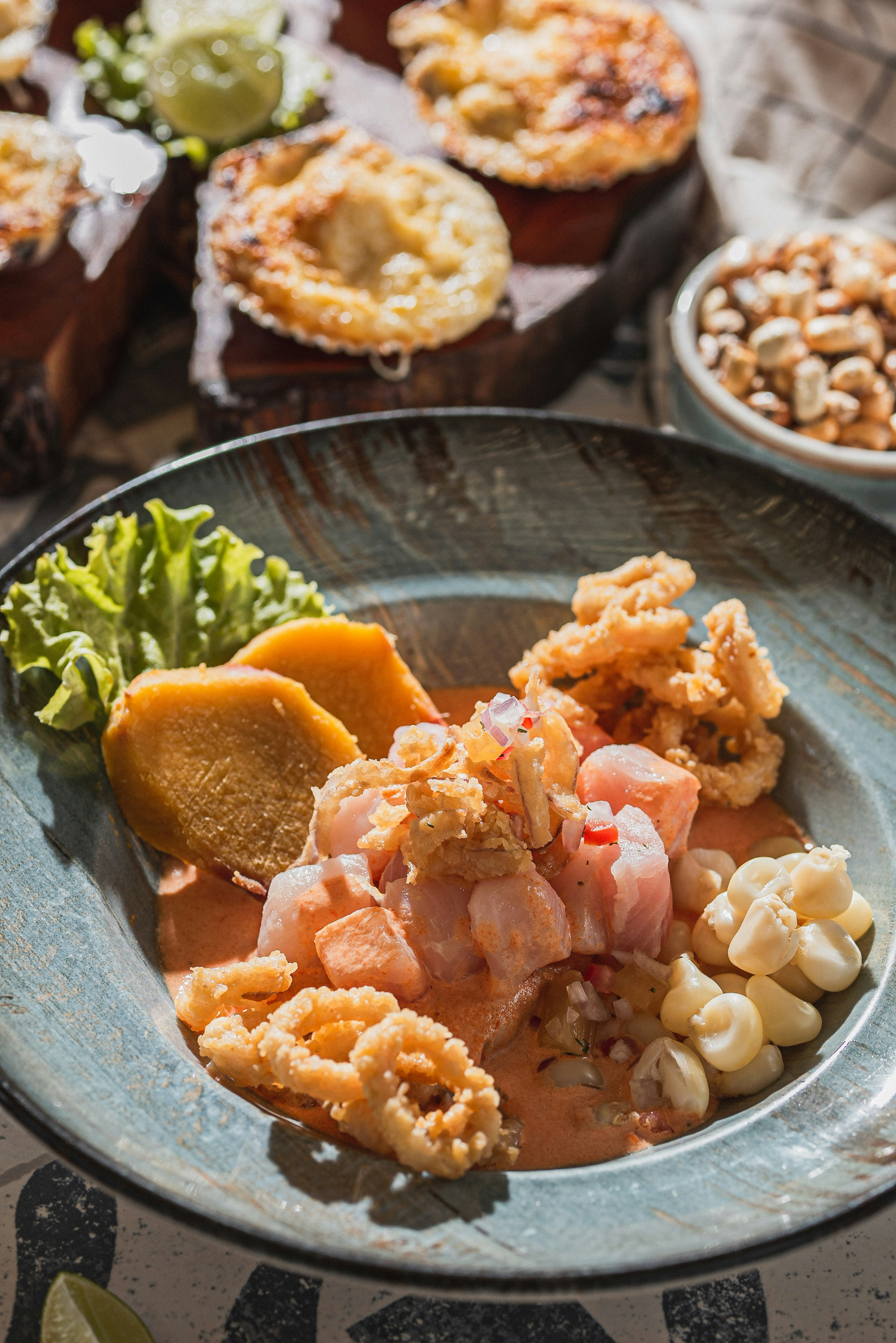 Classic Peruvian ceviche with calamari, sweet potato, corn, and leche de tigre