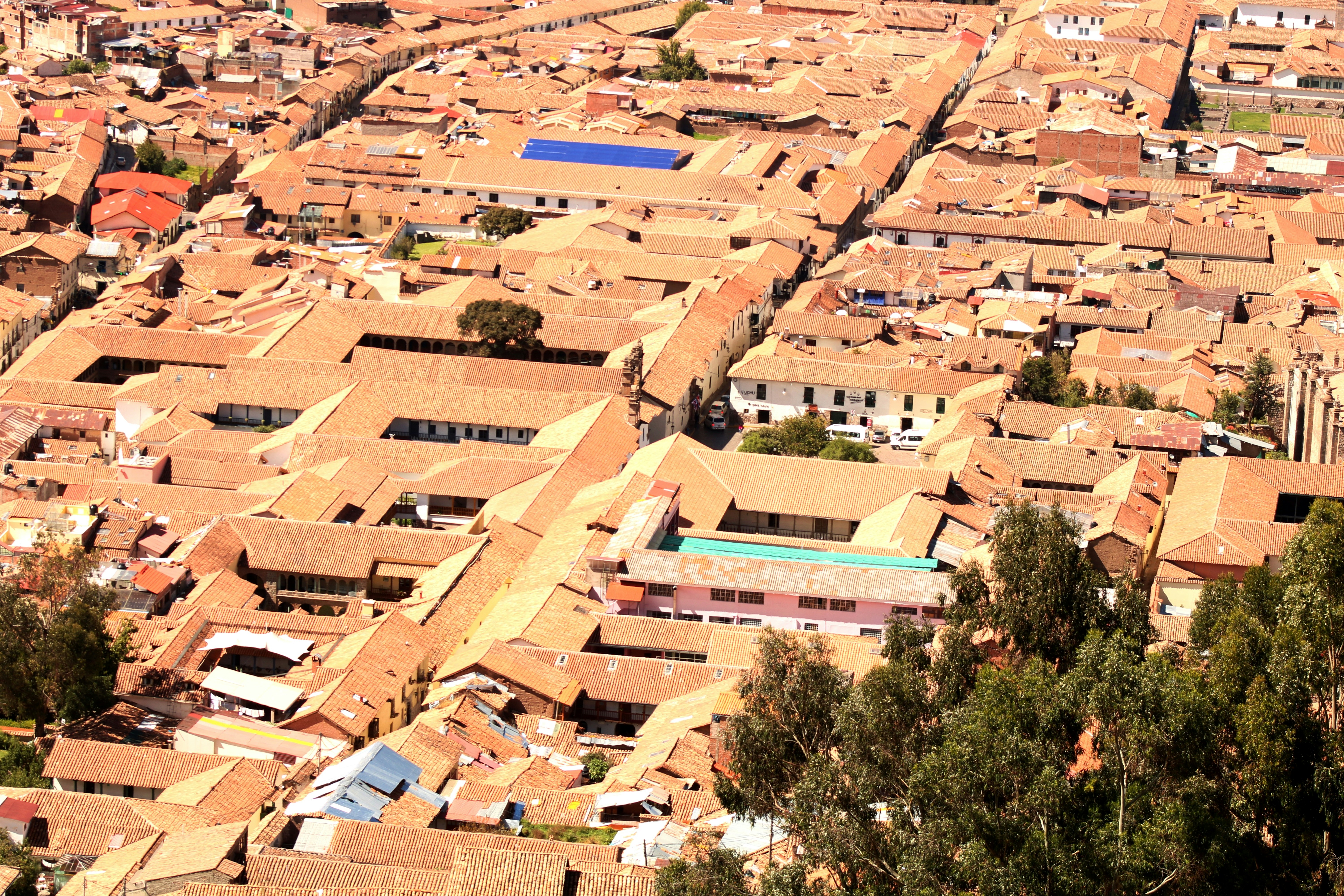 View from Sacsayhuaman fortress over the rooftops of Cusco and surrounding mountains