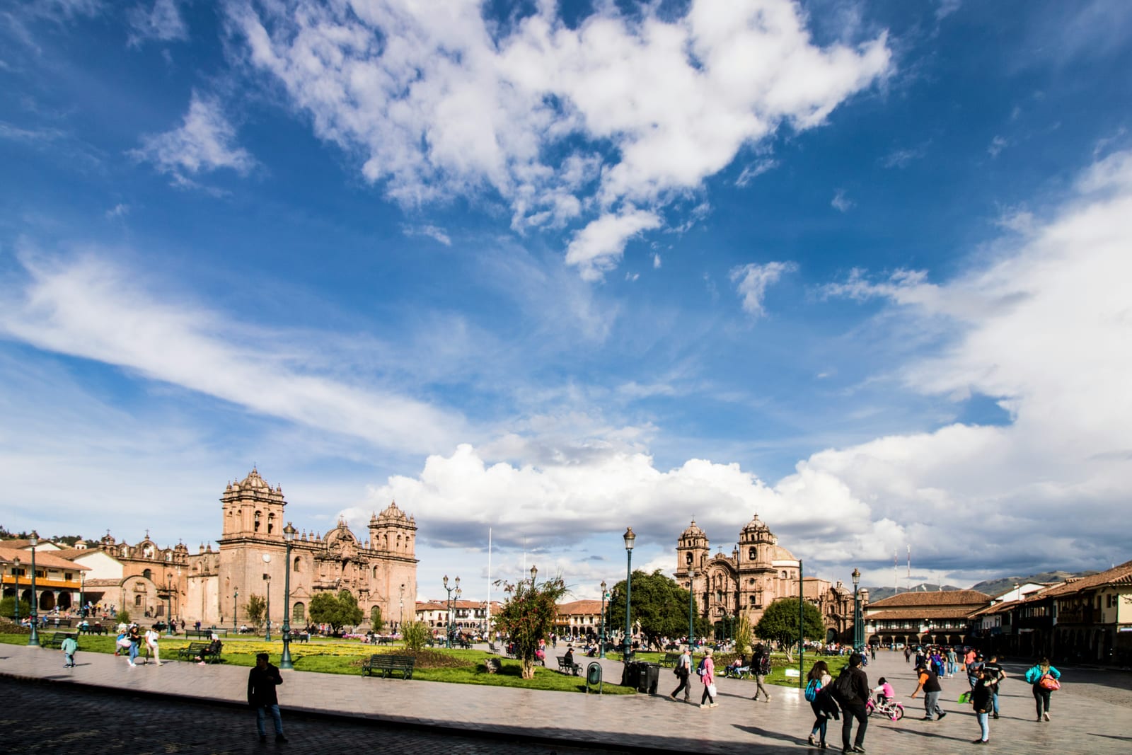 Cusco Plaza de Armas with colonial cathedral and Andean mountain backdrop, Peru
