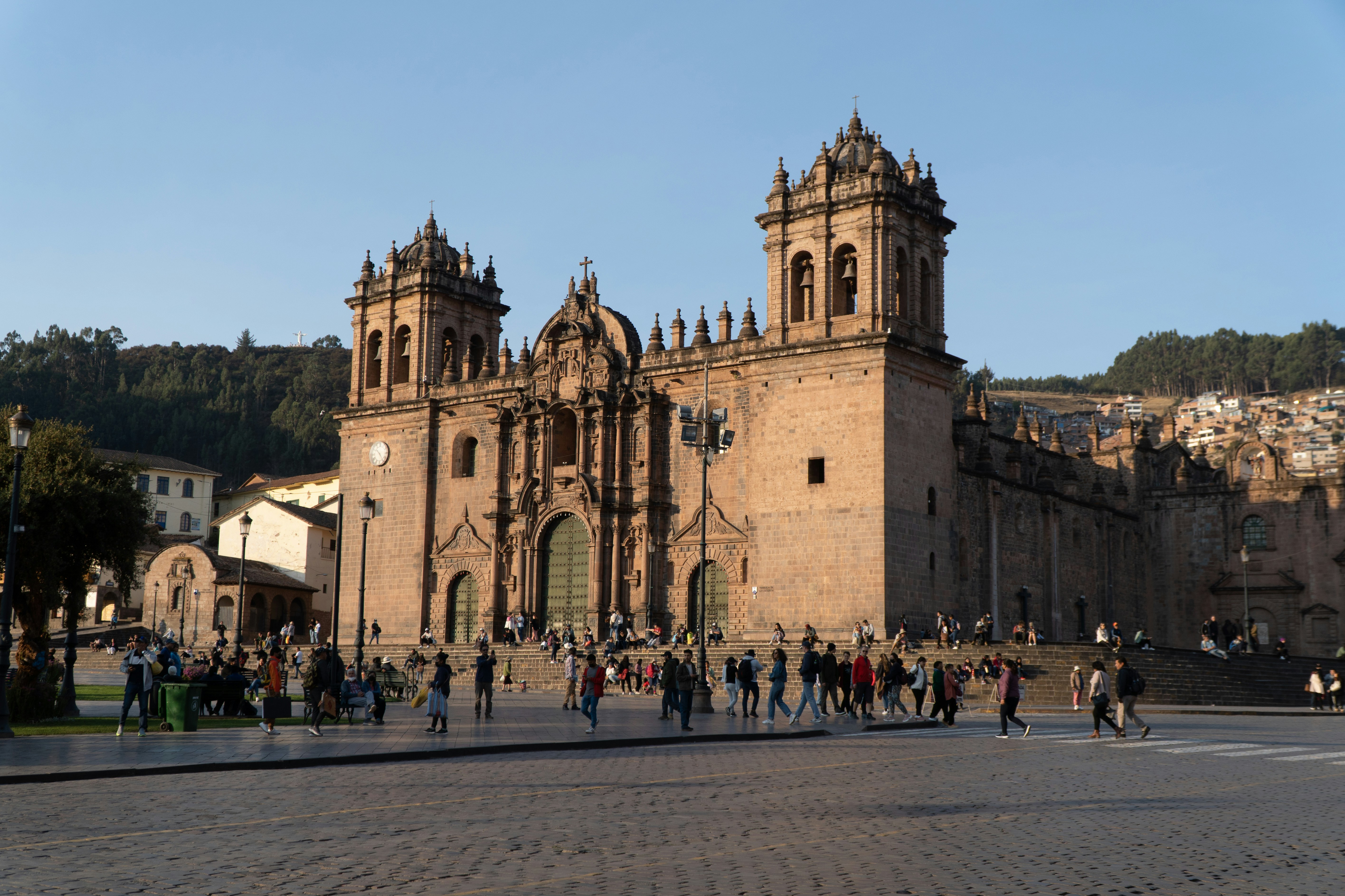 Cusco Cathedral on the Plaza de Armas with crowds at golden hour, Peru