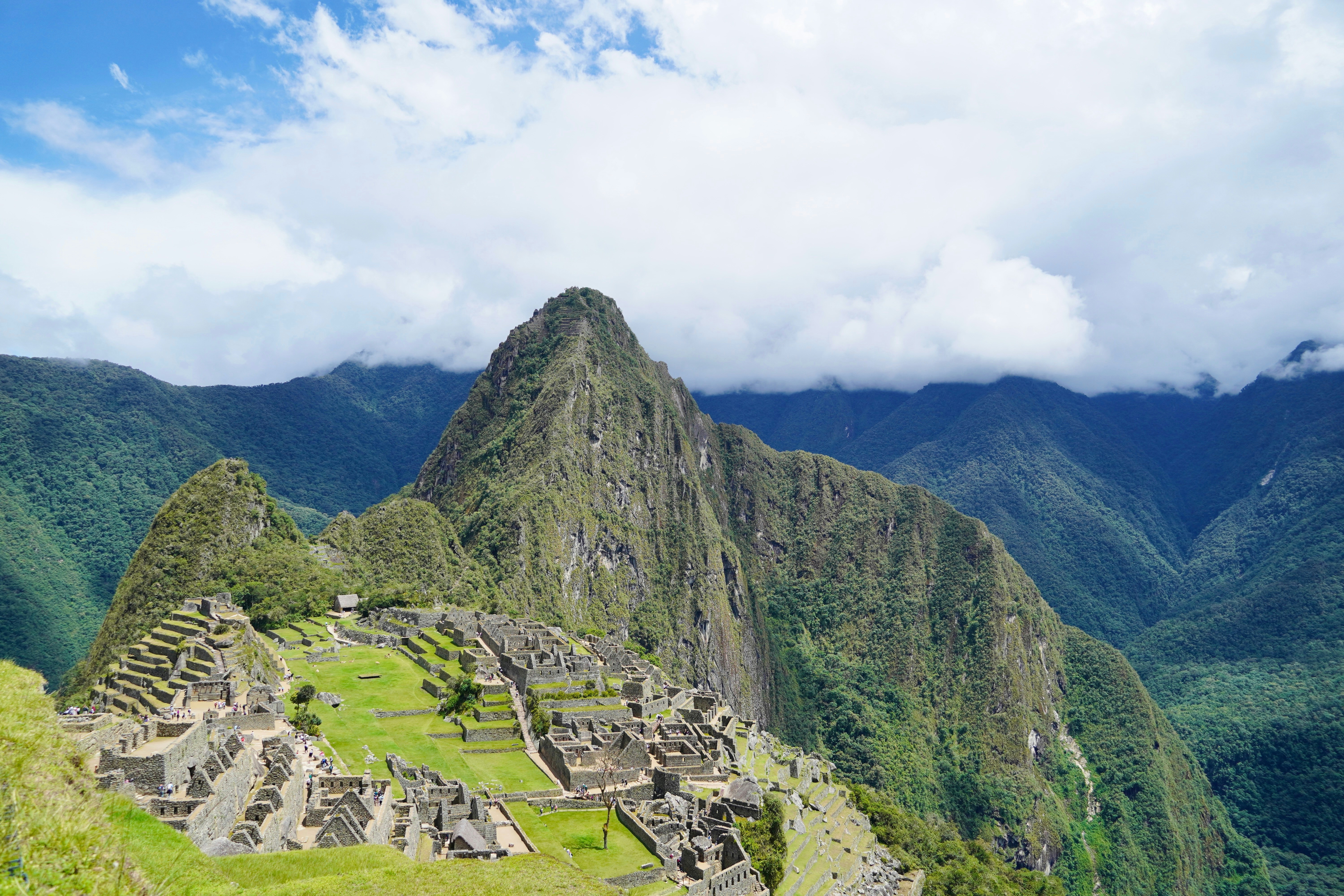Machu Picchu ruins against misty Andean mountains in Peru