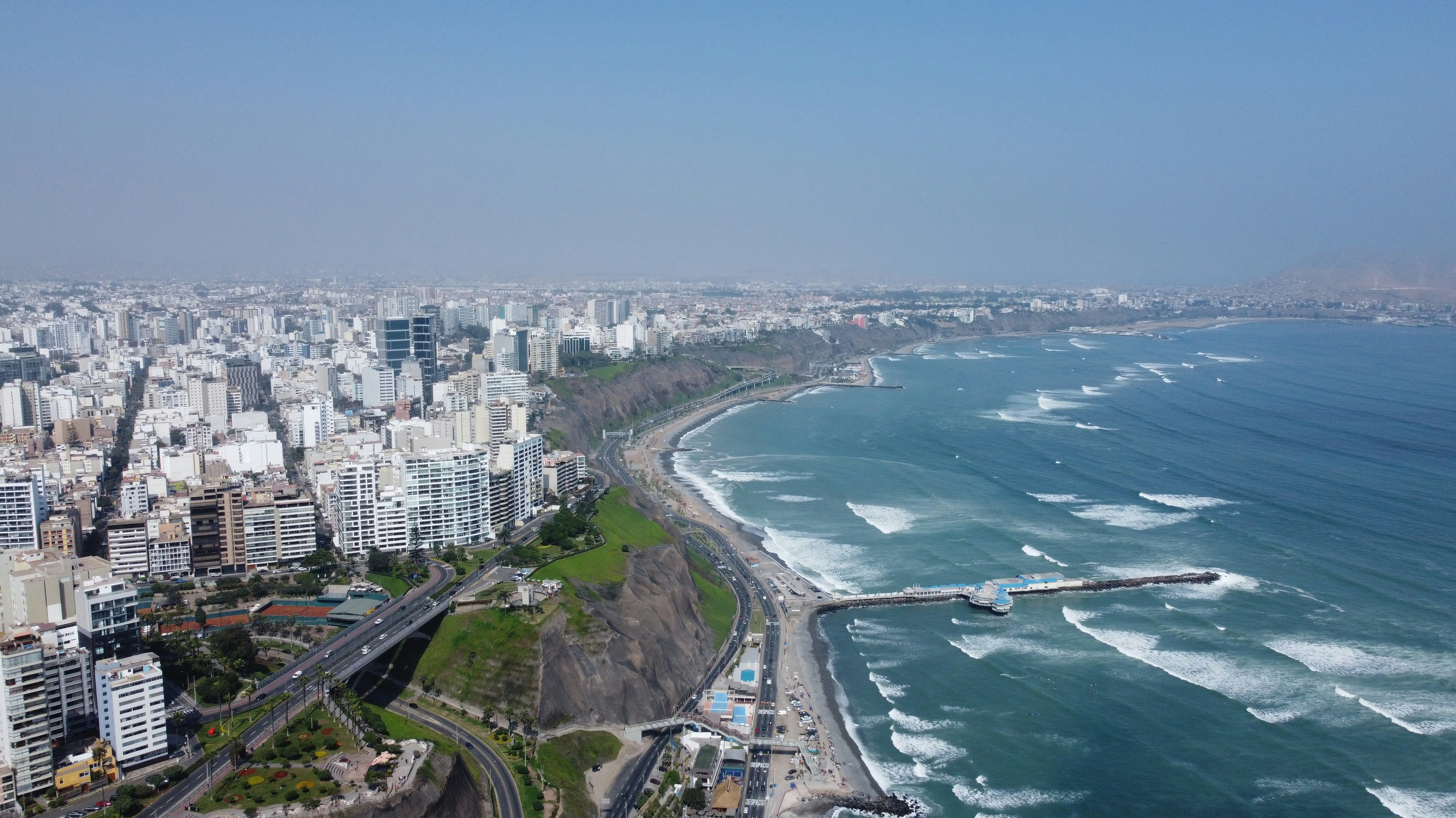 Lima Miraflores coastline from above with Pacific Ocean and summer haze