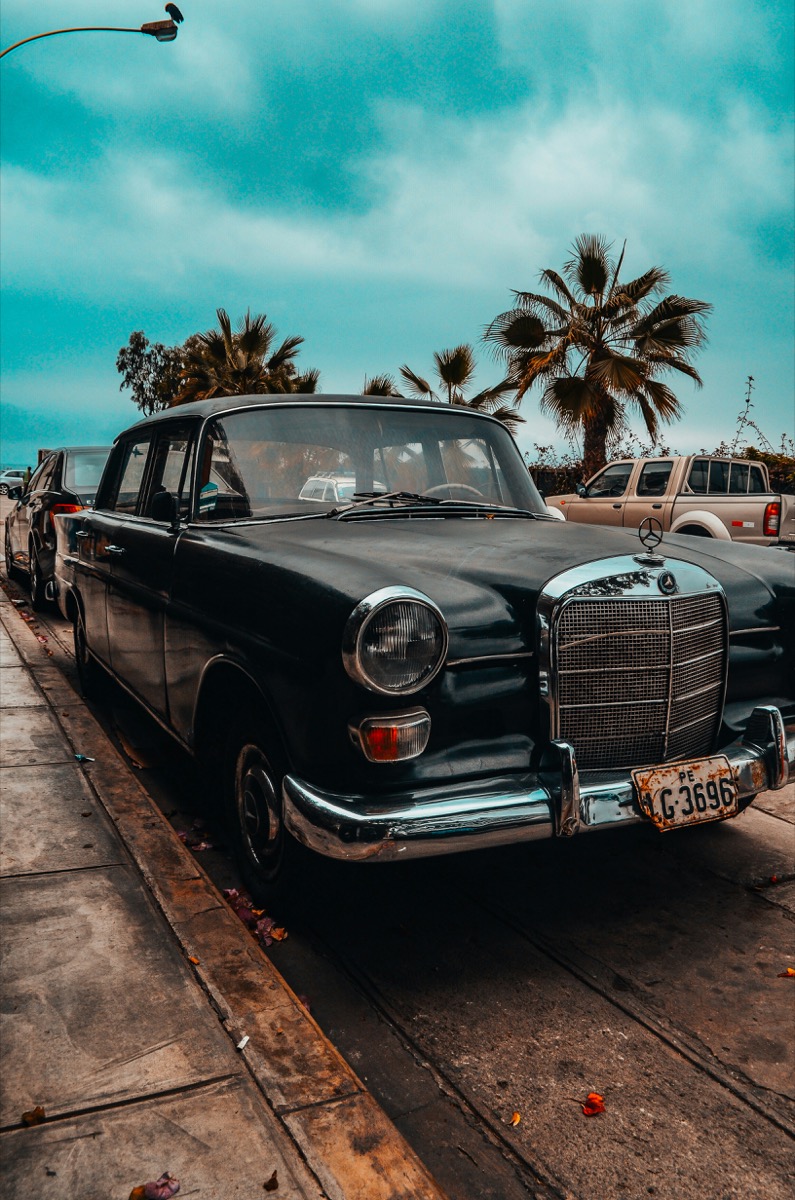 Classic black car parked on a street in Barranco district, Lima, Peru
