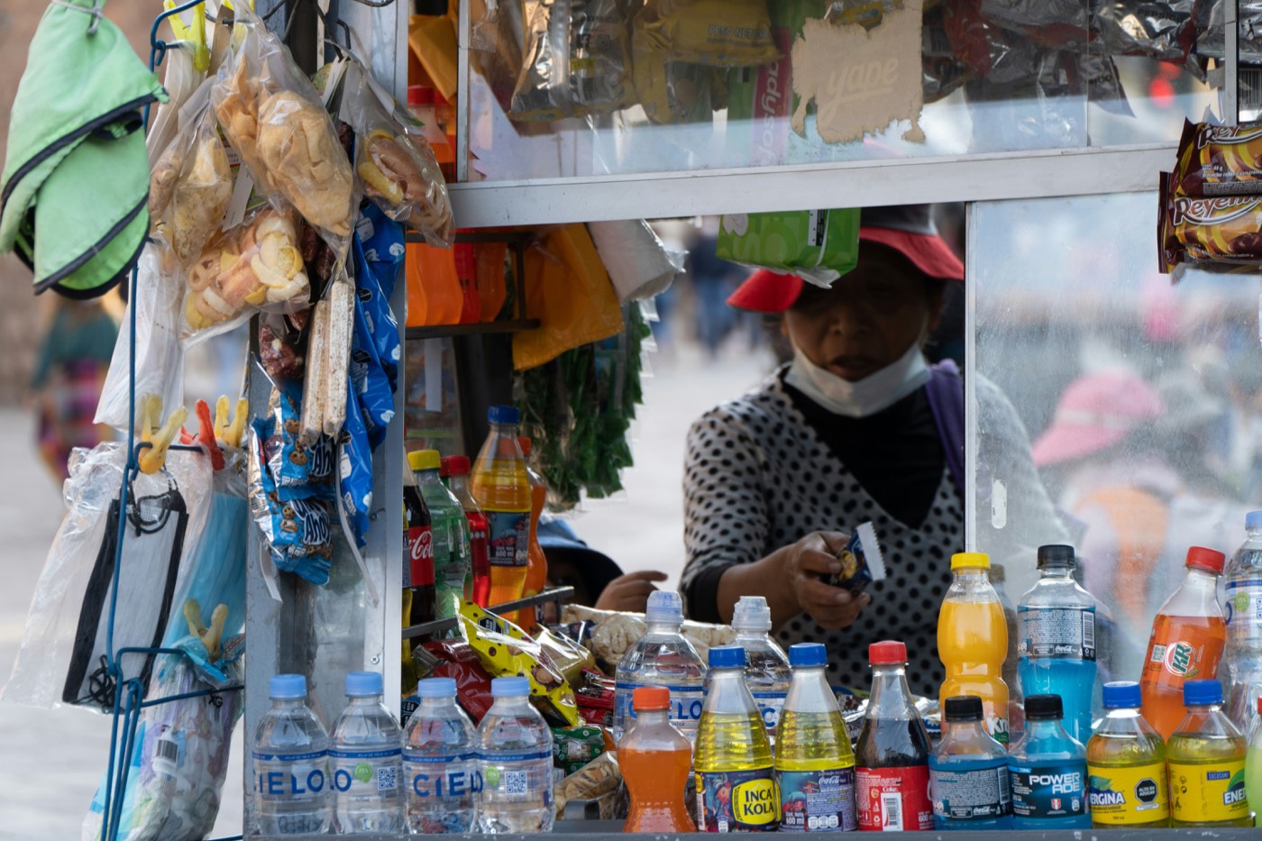 Street vendor stall selling drinks and snacks in Cusco, Peru