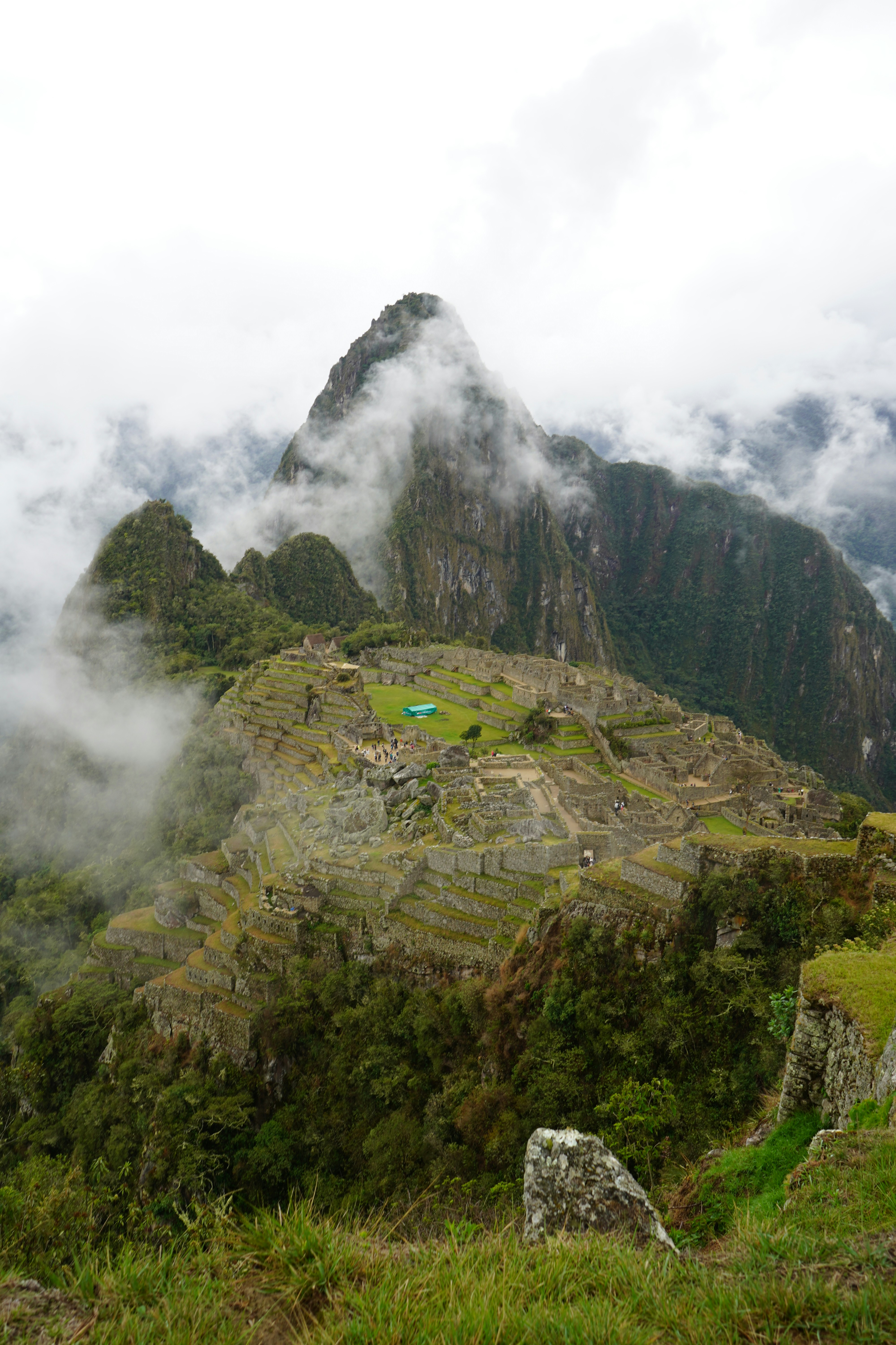 Machu Picchu ruins emerging from low cloud in the shoulder season, Peru