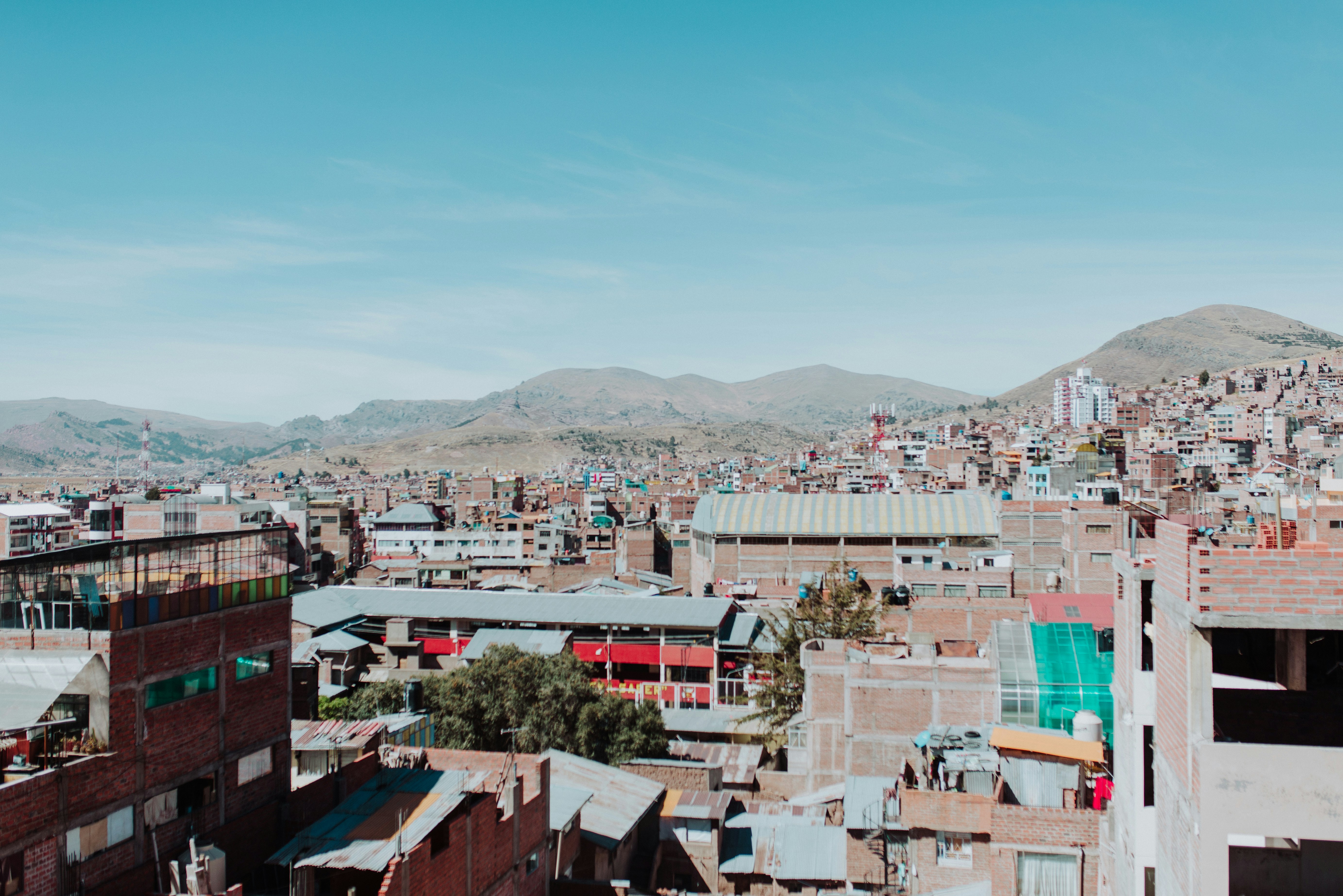 Puno city buildings and rooftops under an Andean sky near Lake Titicaca, Peru