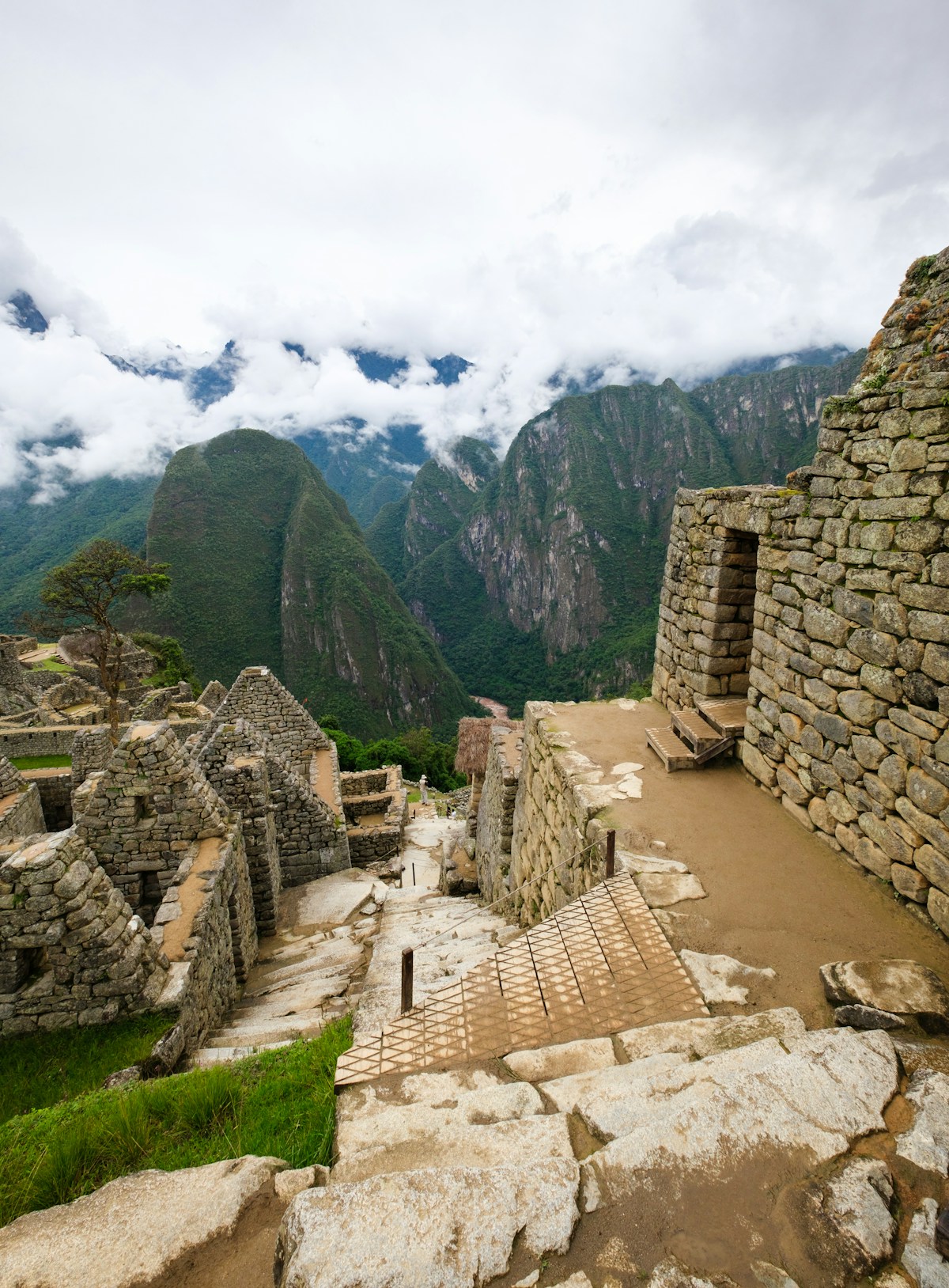 Inca stone ruins on a steep mountainside in the Peruvian Andes