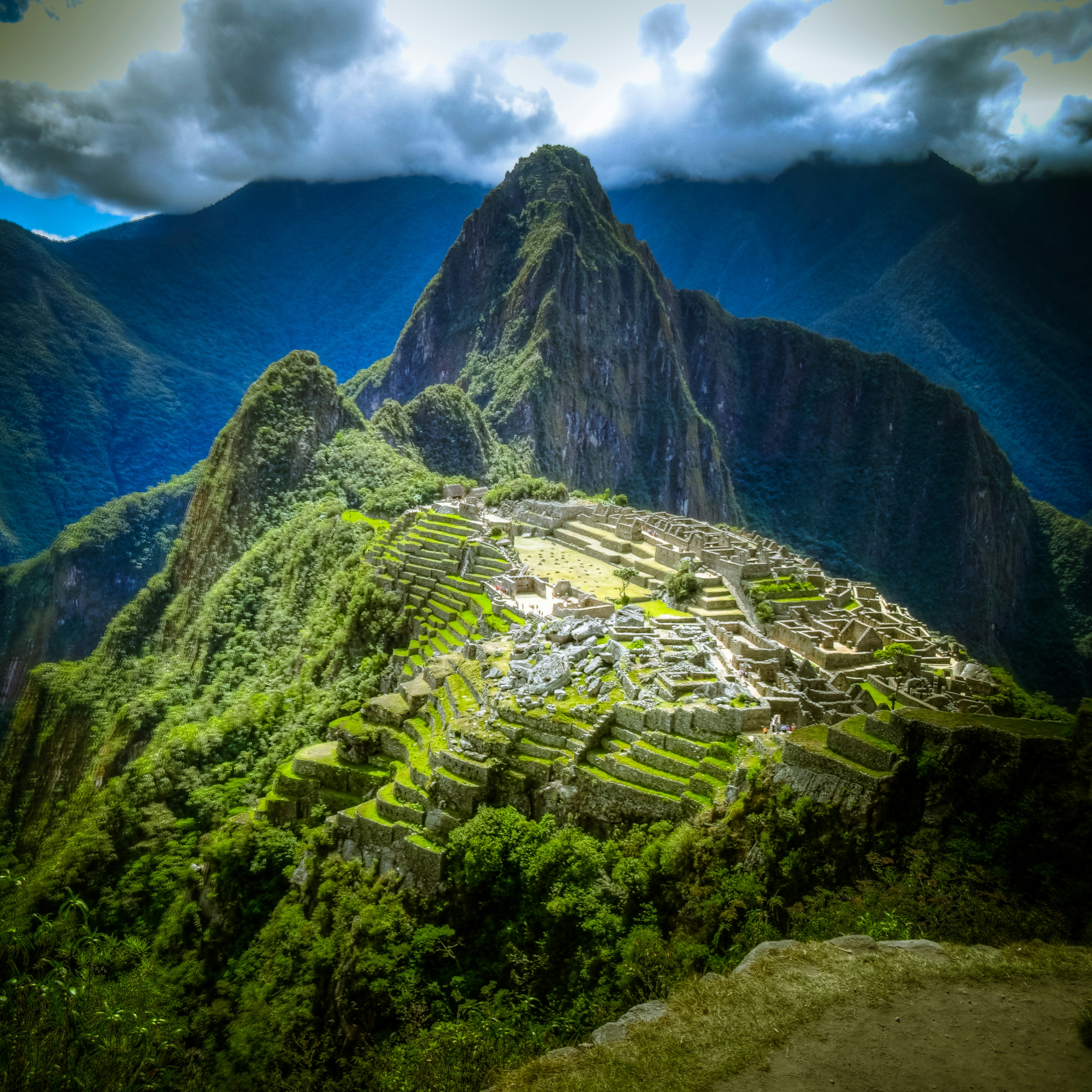 Trekkers on the Inca Trail approaching the Sun Gate above Machu Picchu