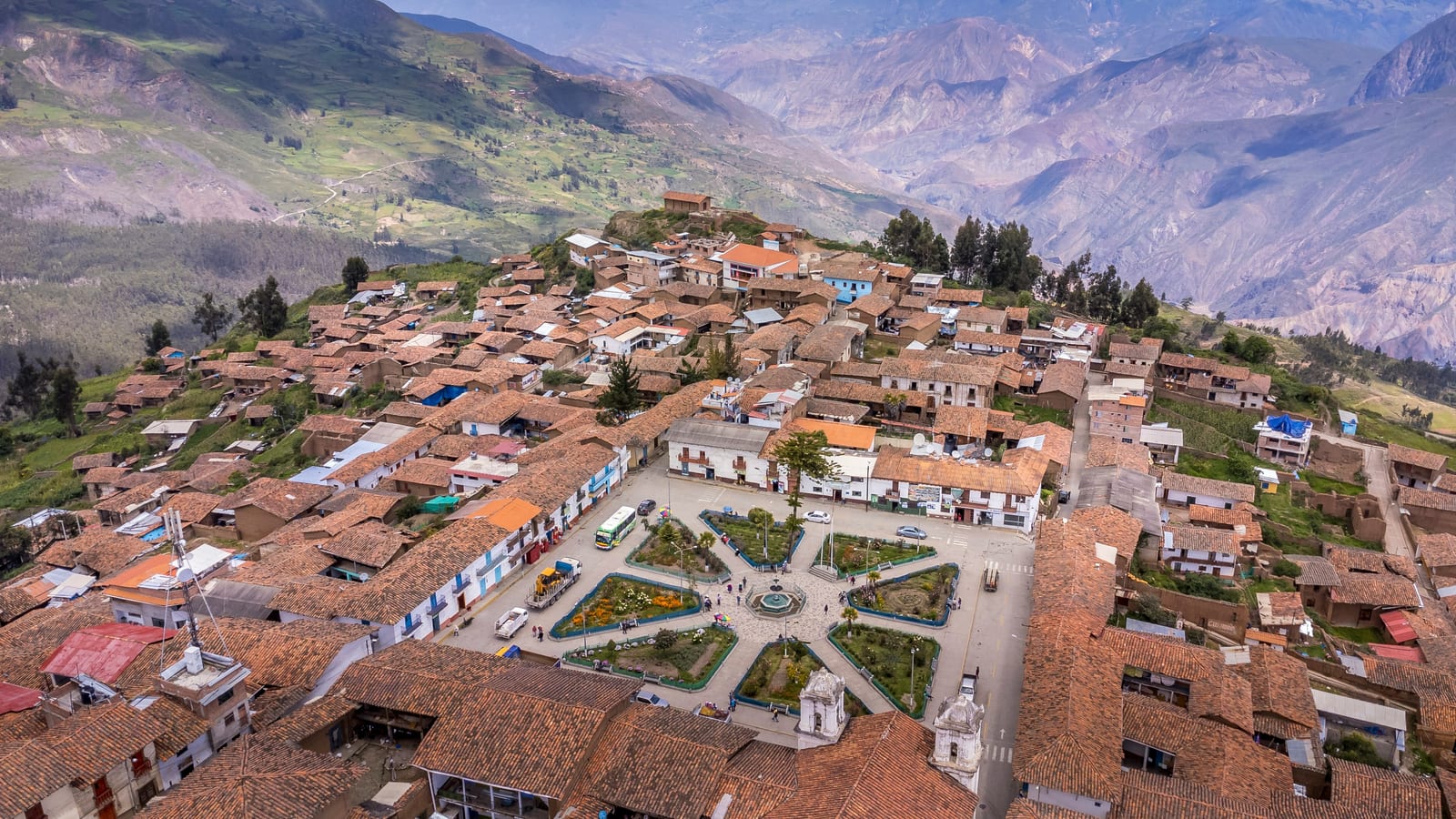 Aerial view of Ayacucho colonial town with central plaza and terracotta rooftops, Andean Peru